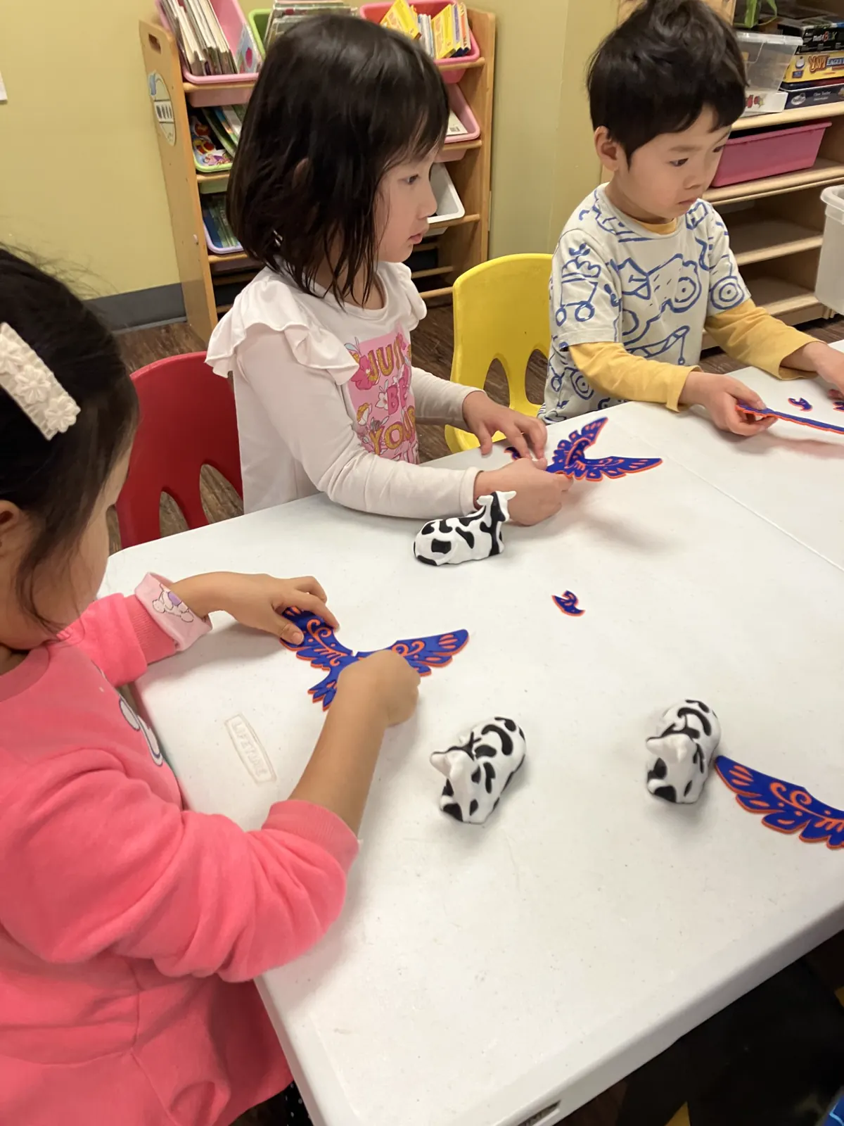 APLS children working on a hands-on craft activity
