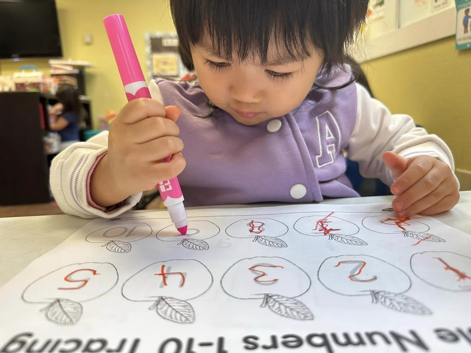 APLS student writing Chinese characters