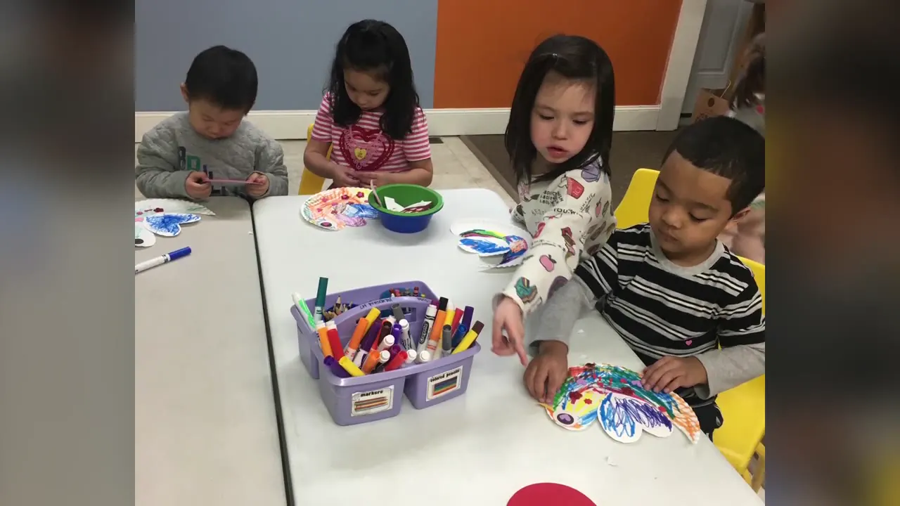 Children coloring together at APLS